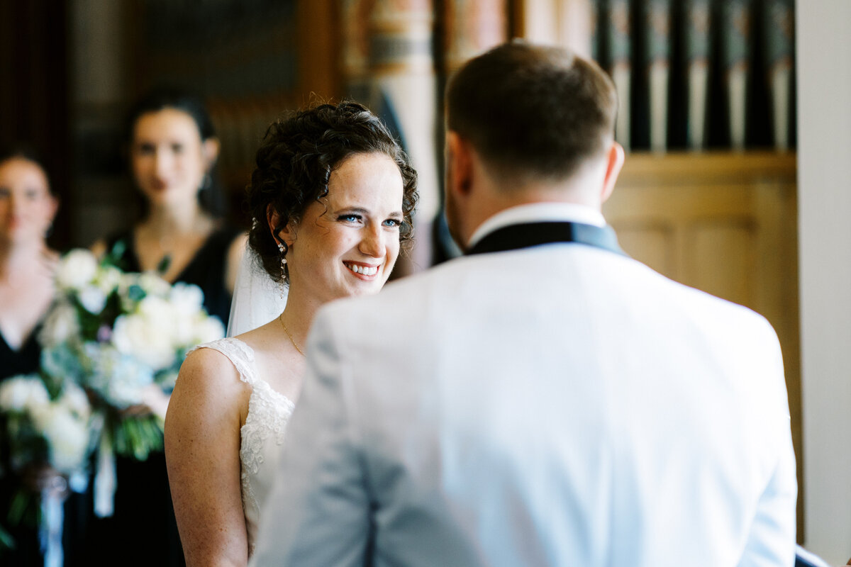 close up of the bride looking in his eyes and  smiling with joy during the ceremony at St James Hotel