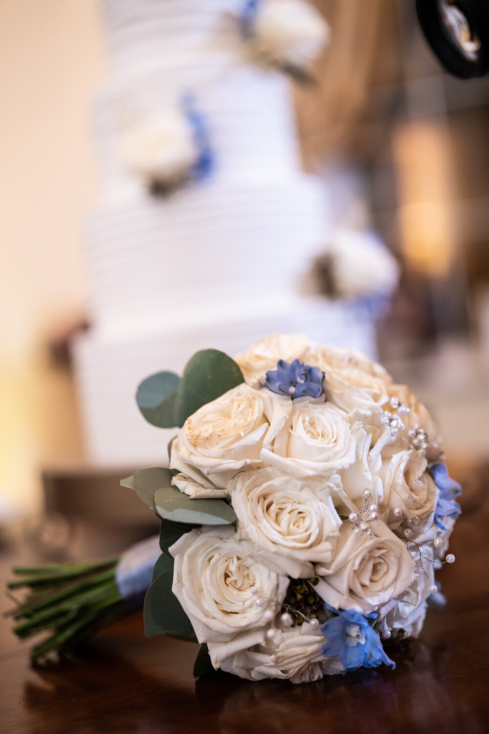Bouquet with cake in the background