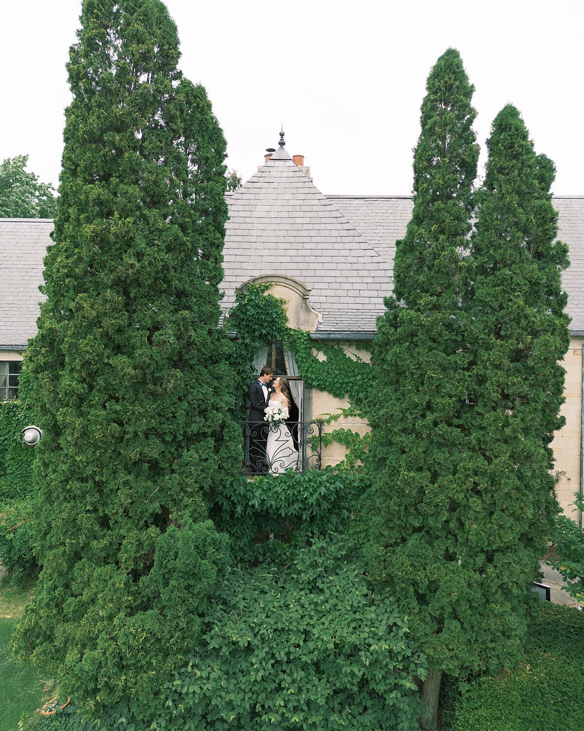 Drone Portriat of Bride and Groom on Balcony at Greencrest Manor