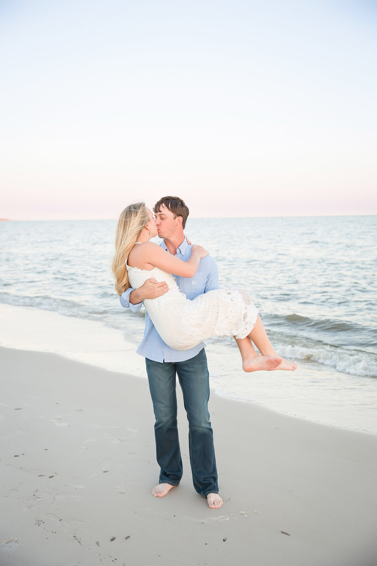 engagement photo on the ocean springs beach