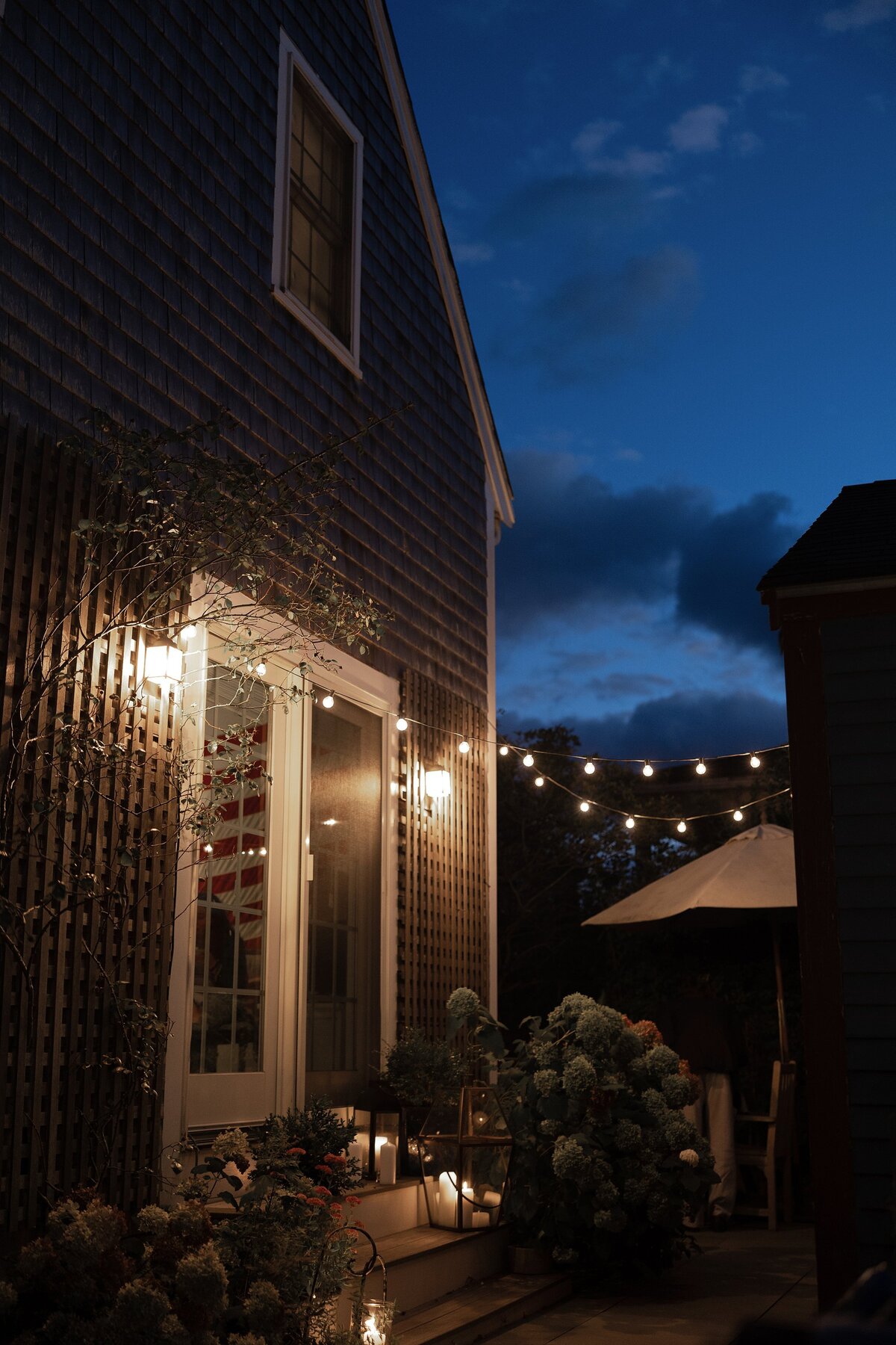 Twilight in backyard of a Nantucket home.
