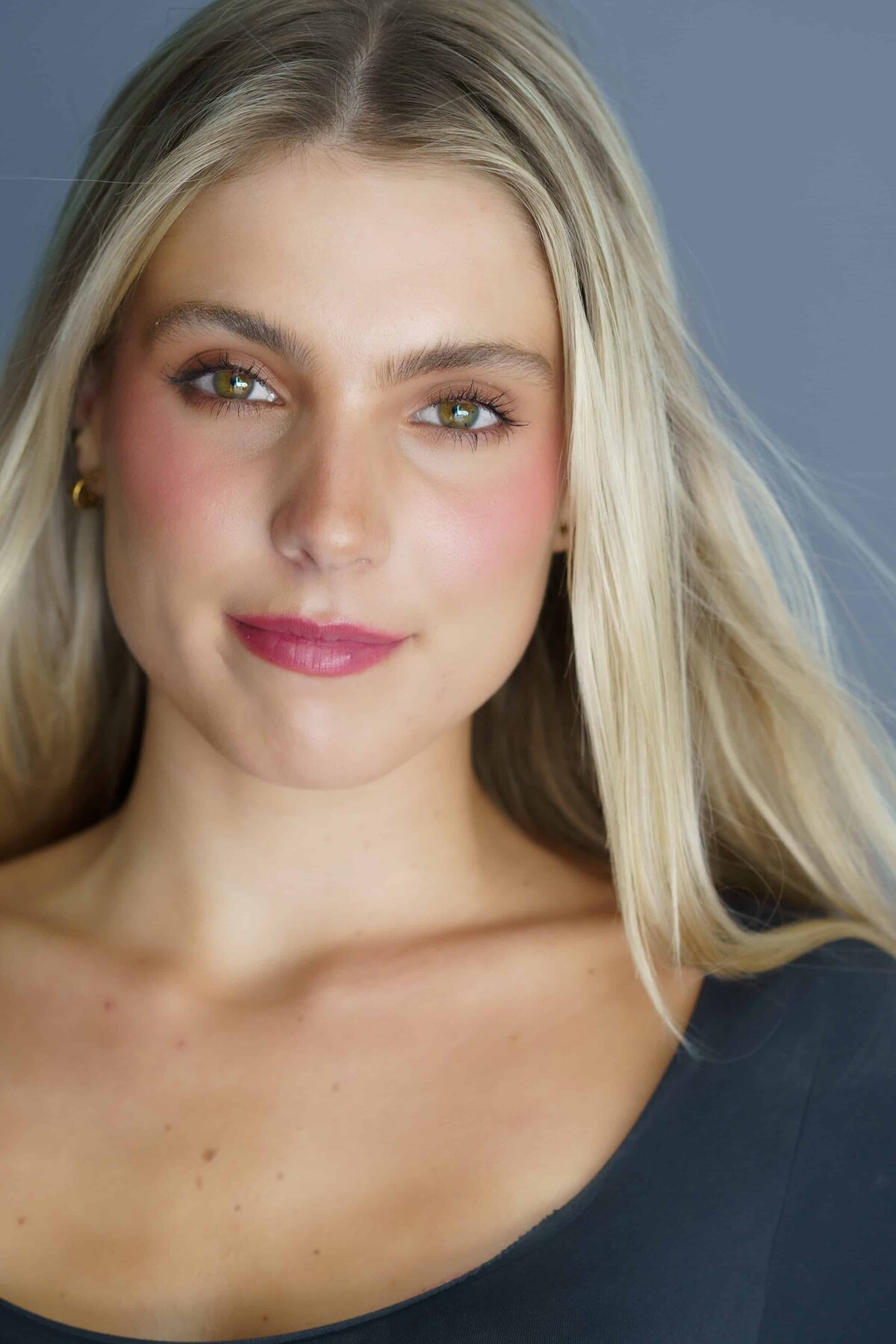 Close up headshot of a beautiful young woman with long hair