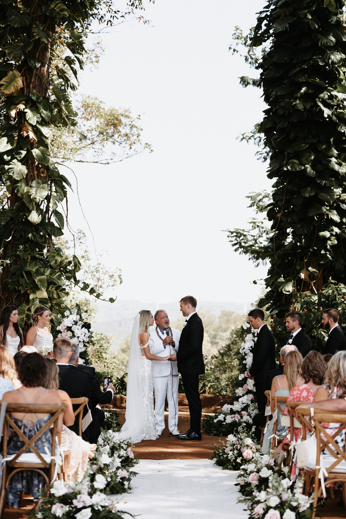 Elopement Photography, wedding ceremony bride and groom looking at each other while guests watch them
