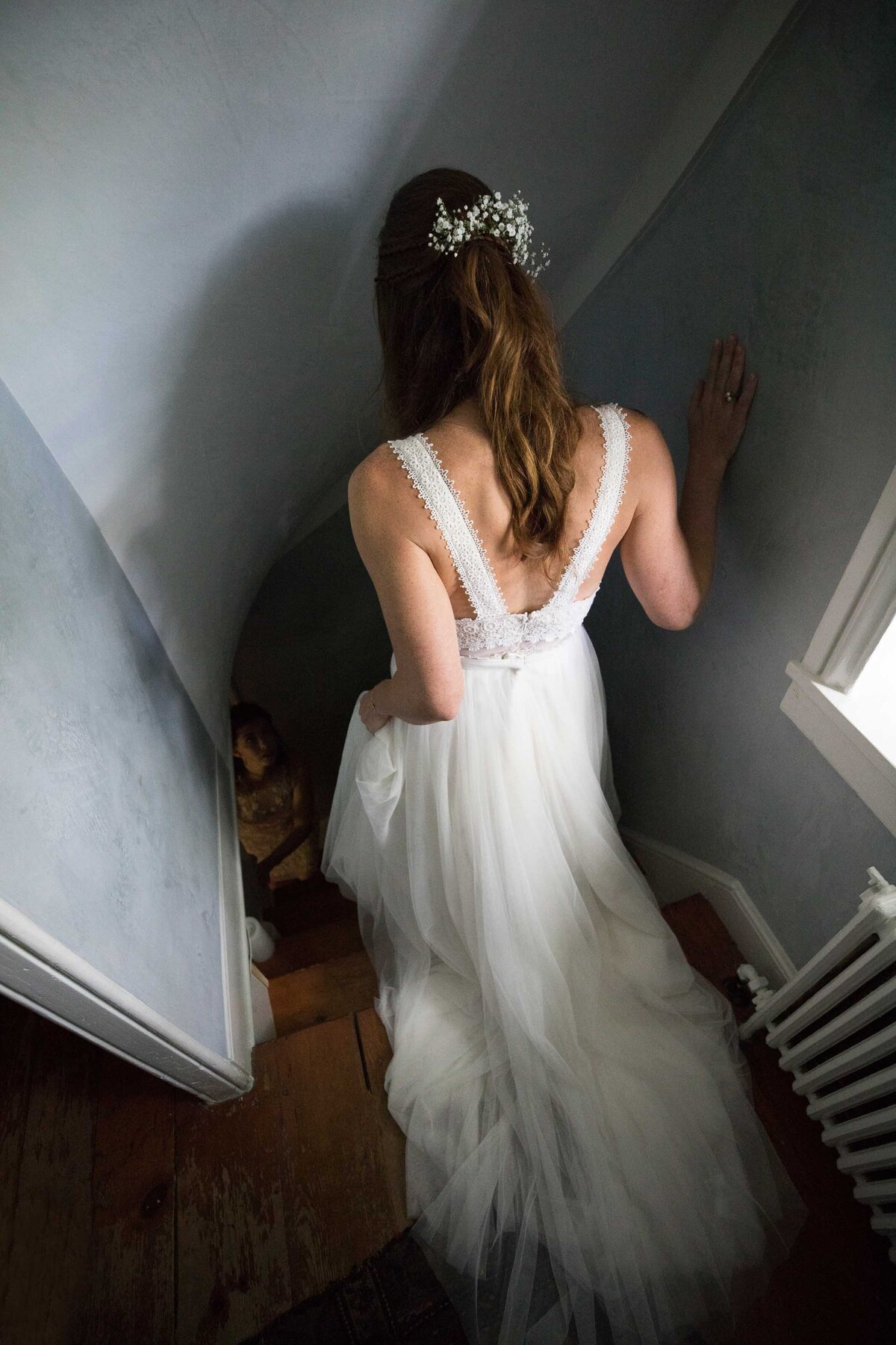 Bride, walking down a stairway at a private estate in New Hope Pennsylvania