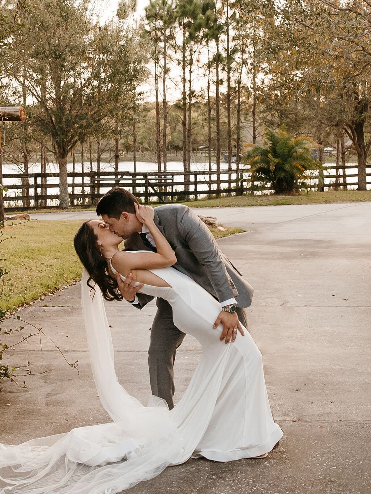 Groom Dipping Bride with kiss at Club Lake Plantation in Apopka, Fl