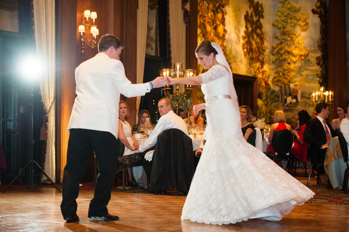 bride and groom dancing together at duquesne club on dance floor