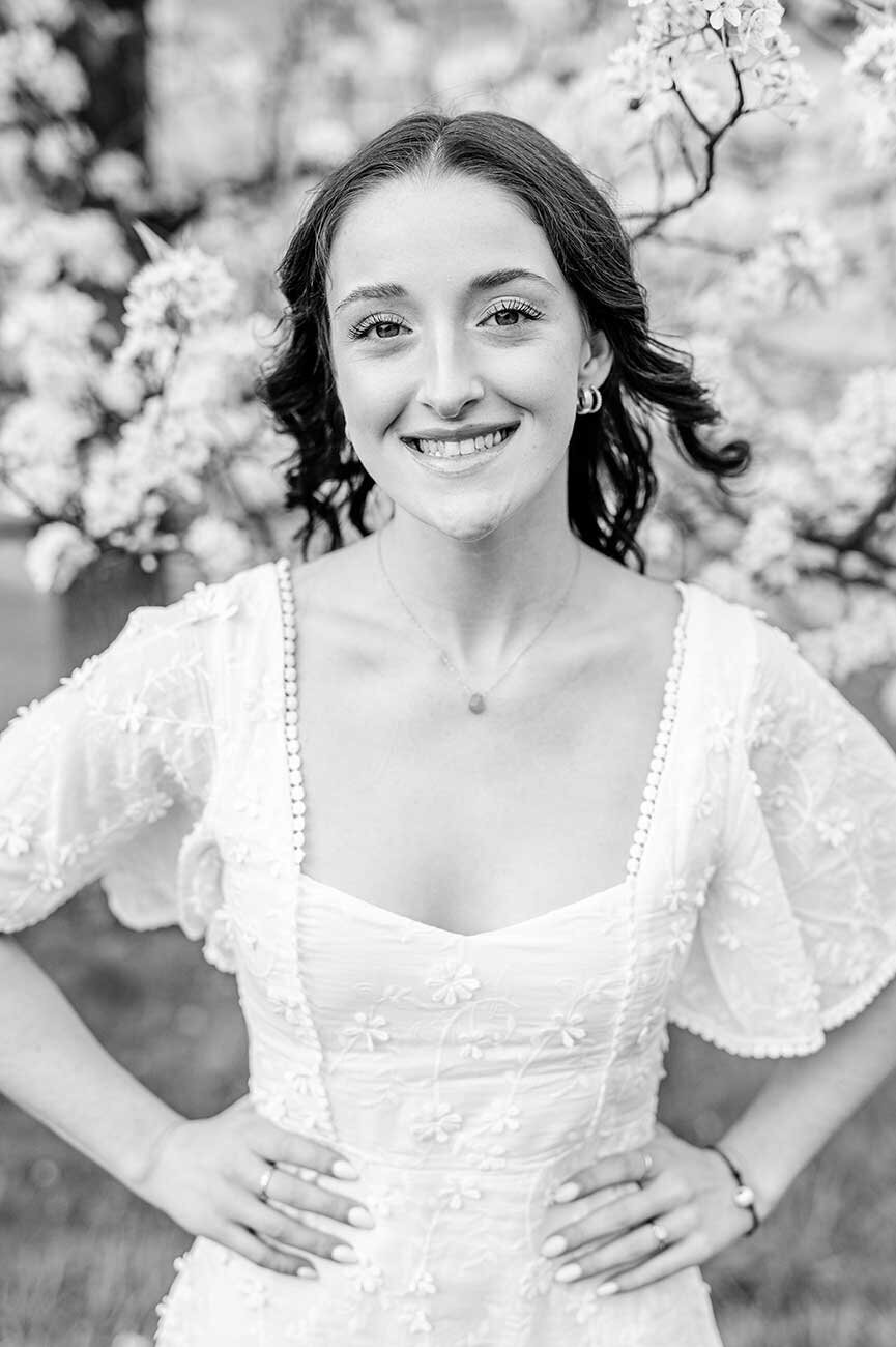 College graduate in white lace dress