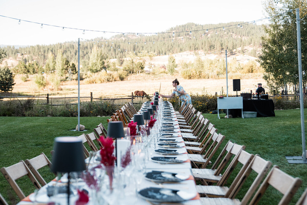 Table setting preparations by Perfect Thirds & Co. at a Boise wedding.