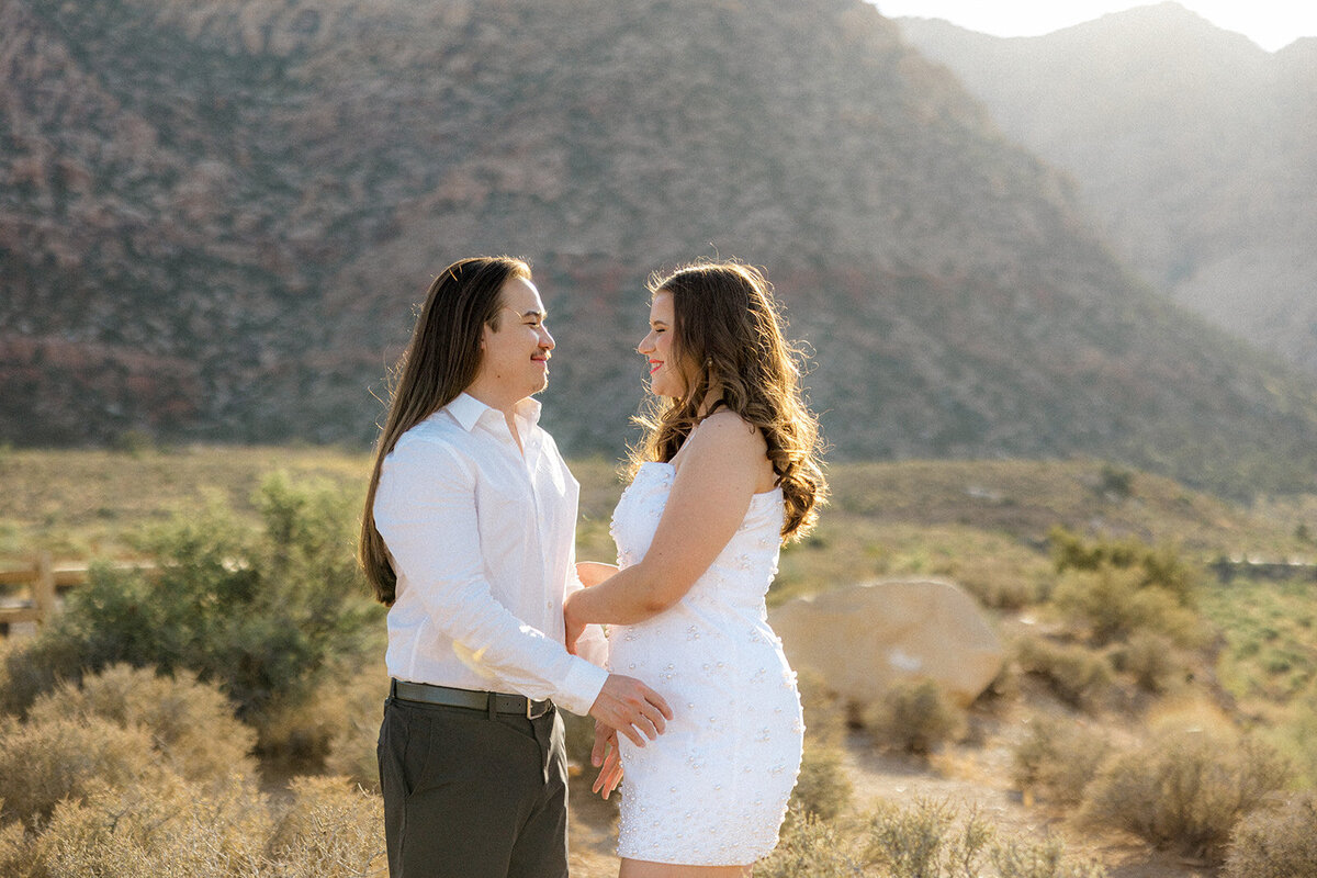 Engaged couples hugging looking into each other eyes in Nevada