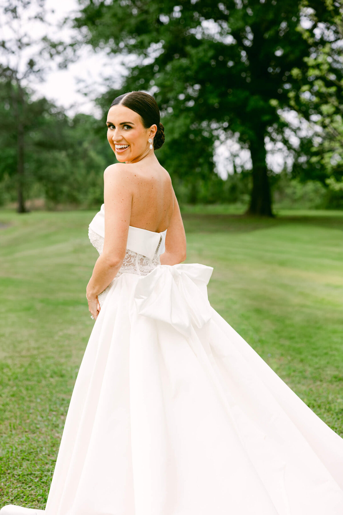 A wedding day portrait photo of the bride in her white wedding dress