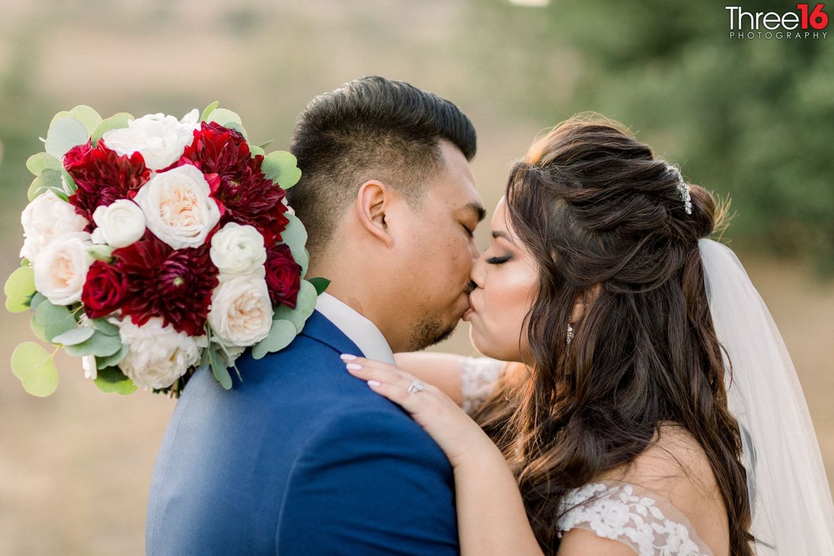 Bride and Groom share a kiss to seal the deal
