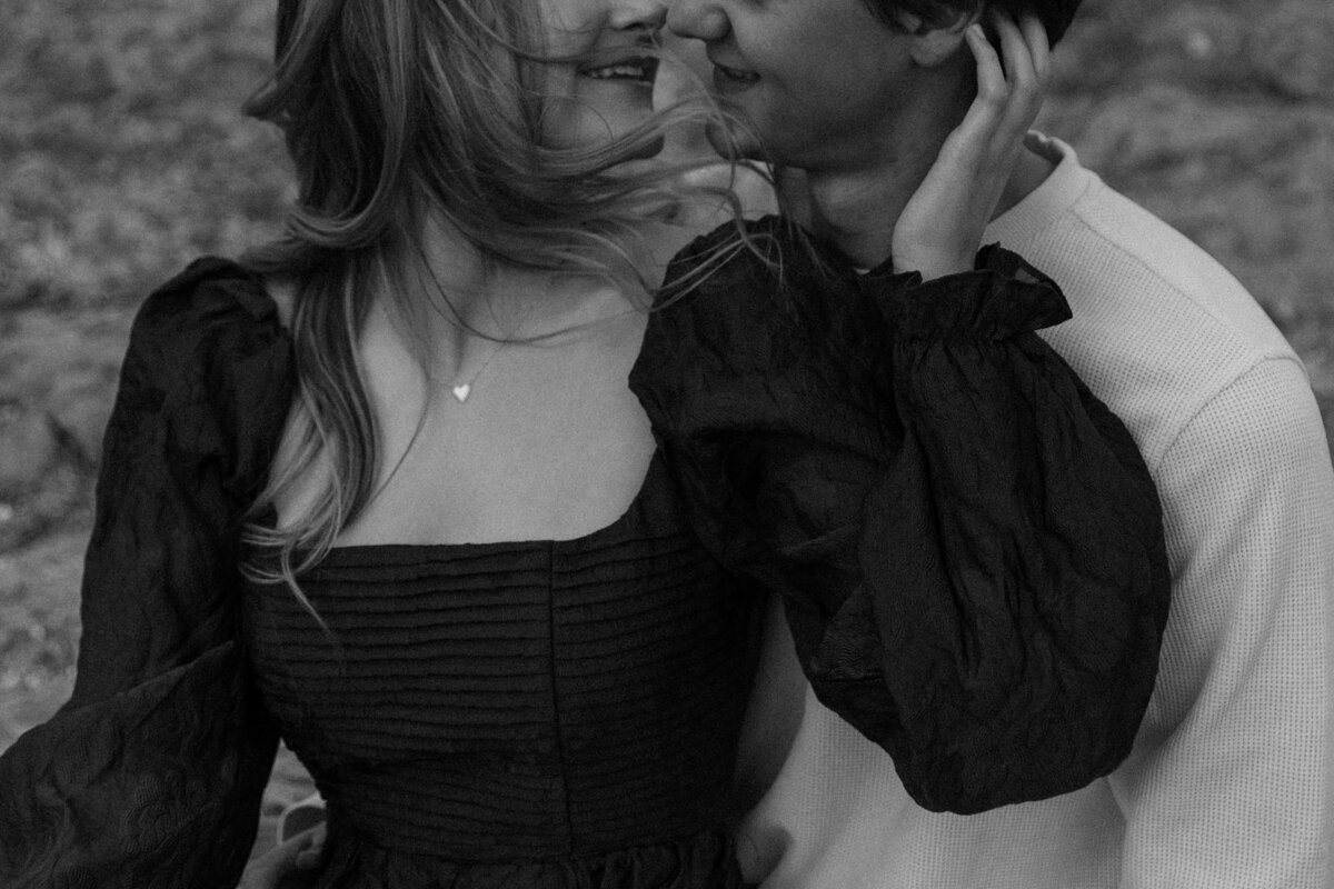 Close Up of Couple kissing with emphasis on their outfits 