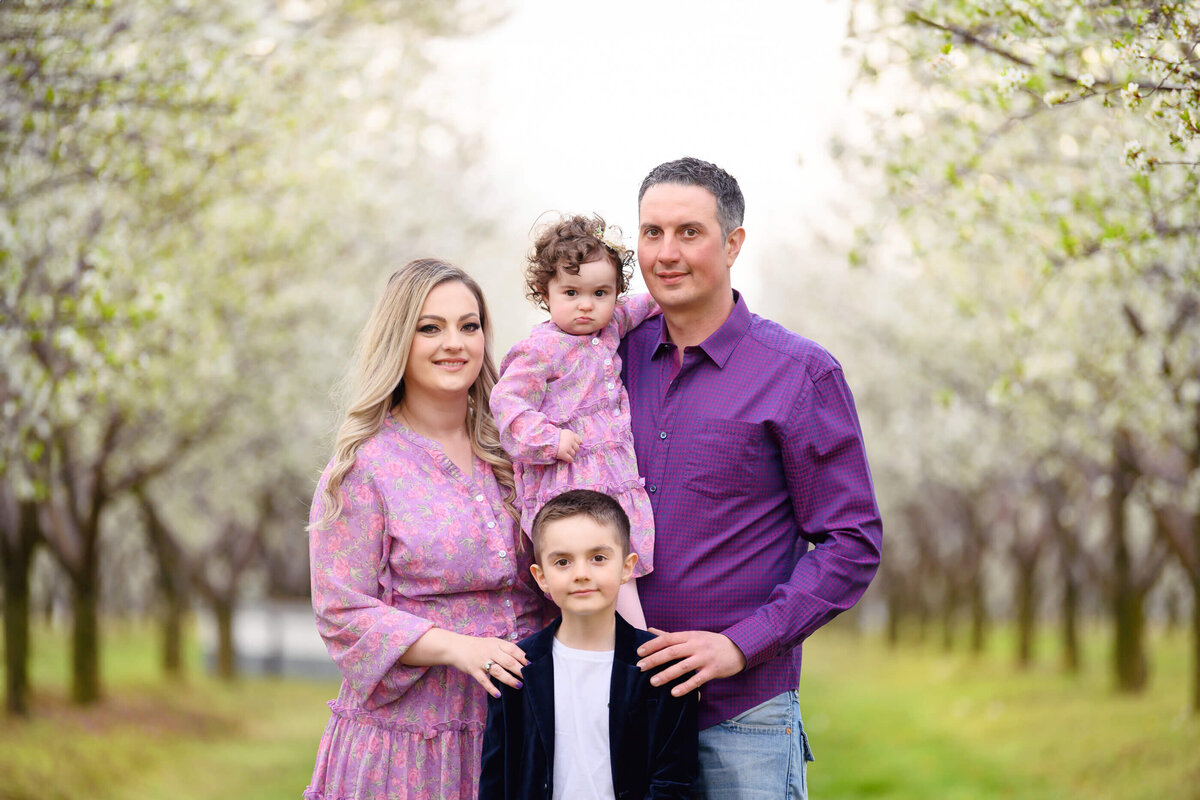 Close-up Burlington family photo at the white cherry blossom farm