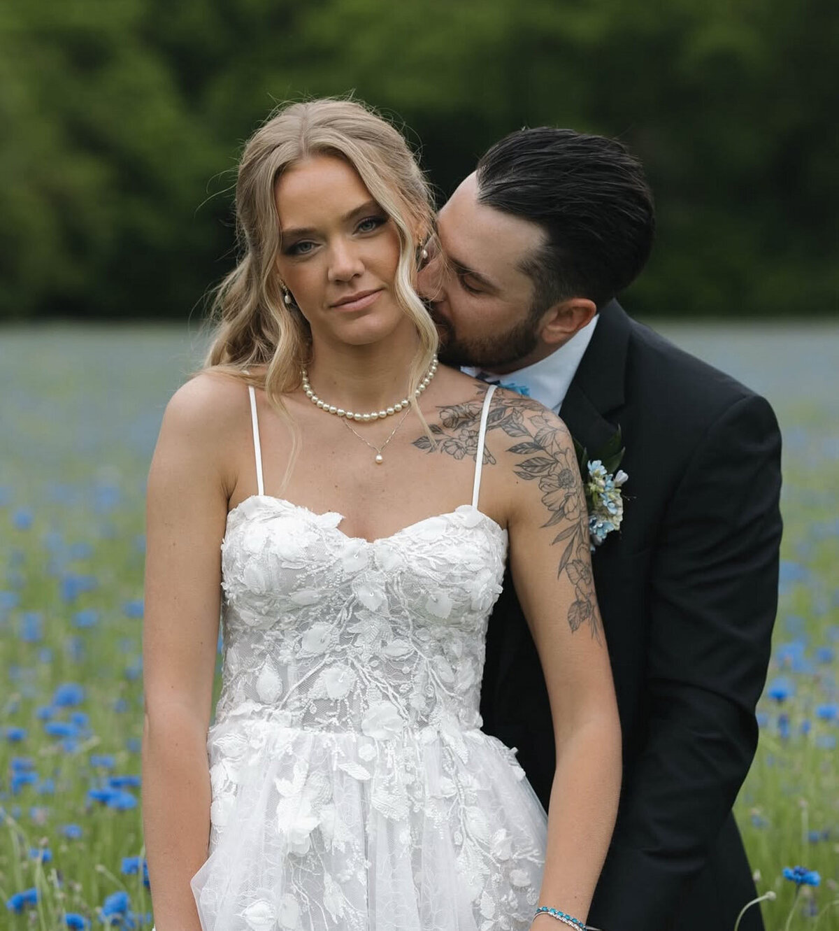 Groom kissing brides neck