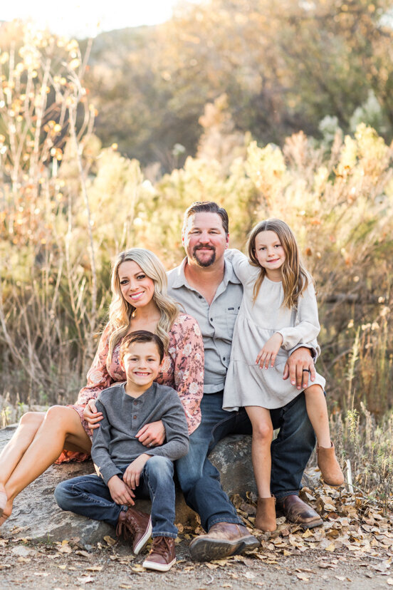 family-sitting-on-rock-mission-trails-san-diego