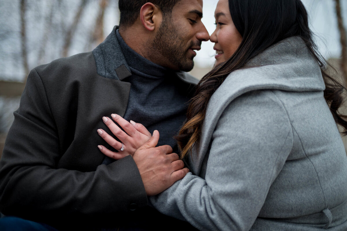 fiance and fiancee embracing during engagement session.