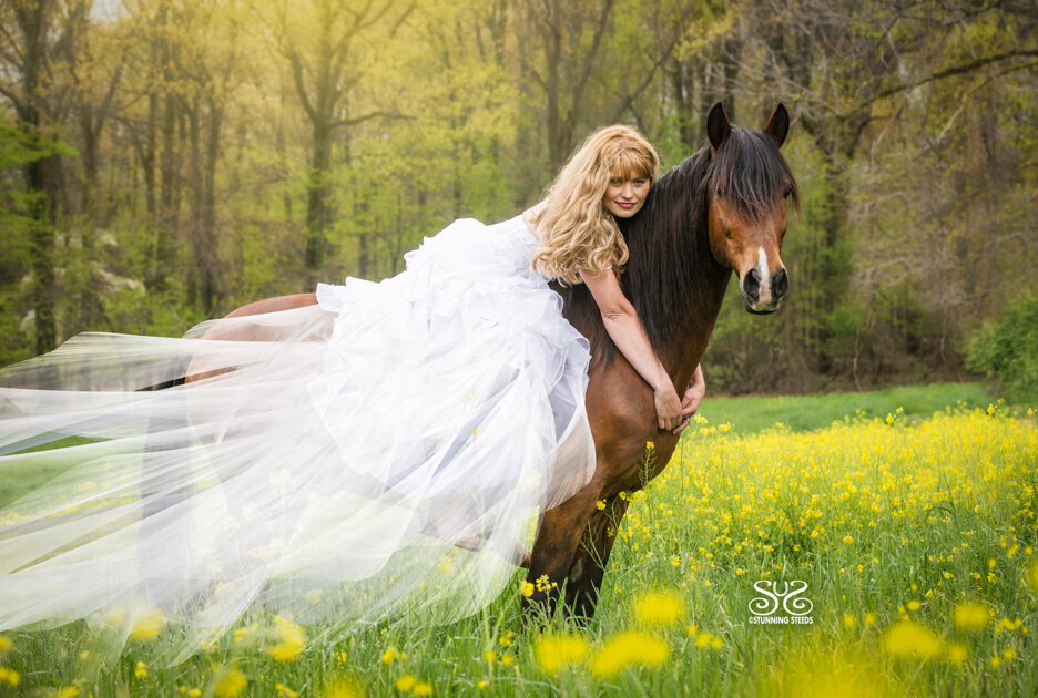 woman in dress on horse