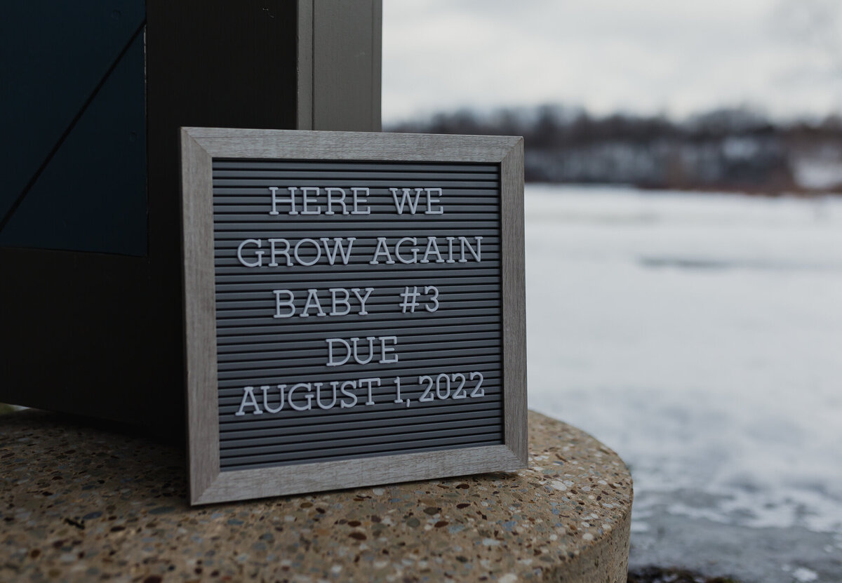 Pregnancy announcement board.
