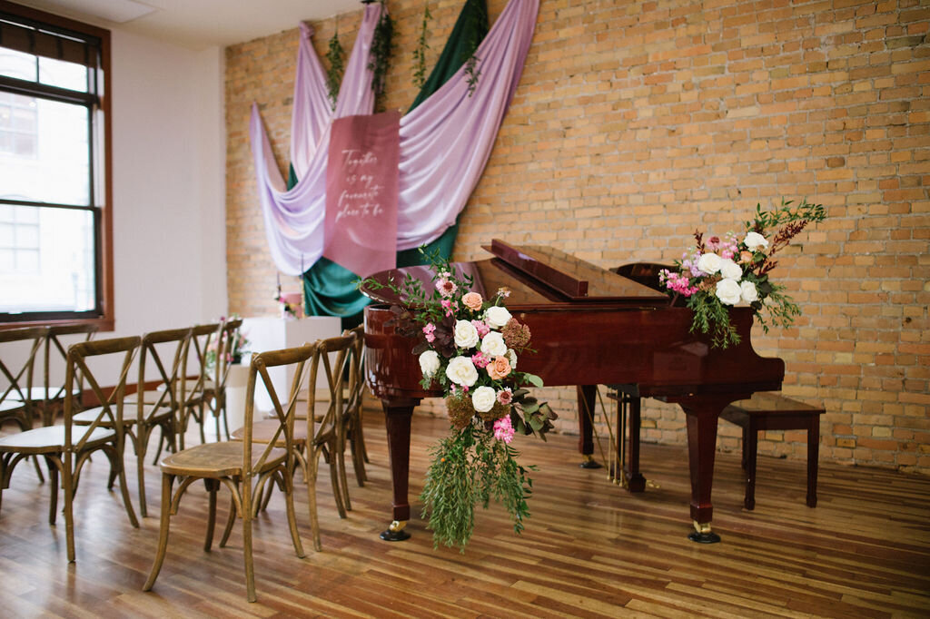 Colourful wedding ceremony with pops of pink and emerald green at The Garret, historical and sophisticated, Calgary, Alberta wedding venue, featured on the Brontë Bride Vendor Guide.