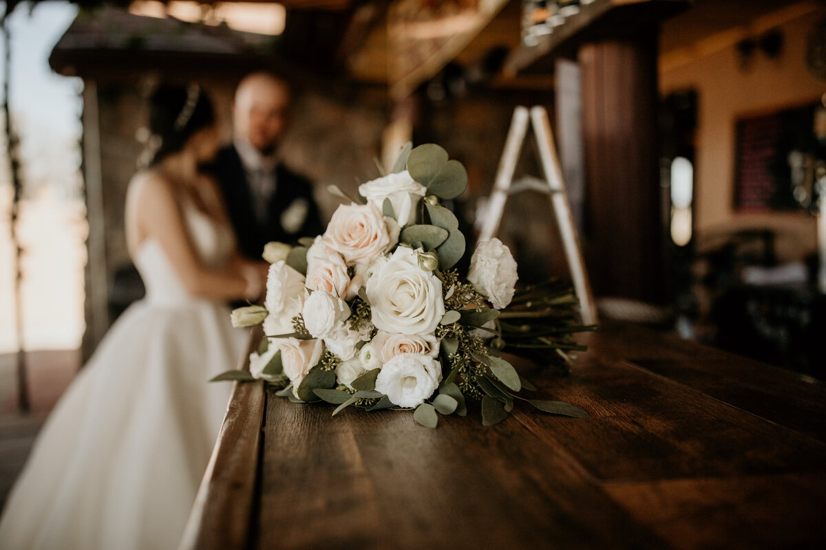 bride and groom standing at a bar together in New Mexico