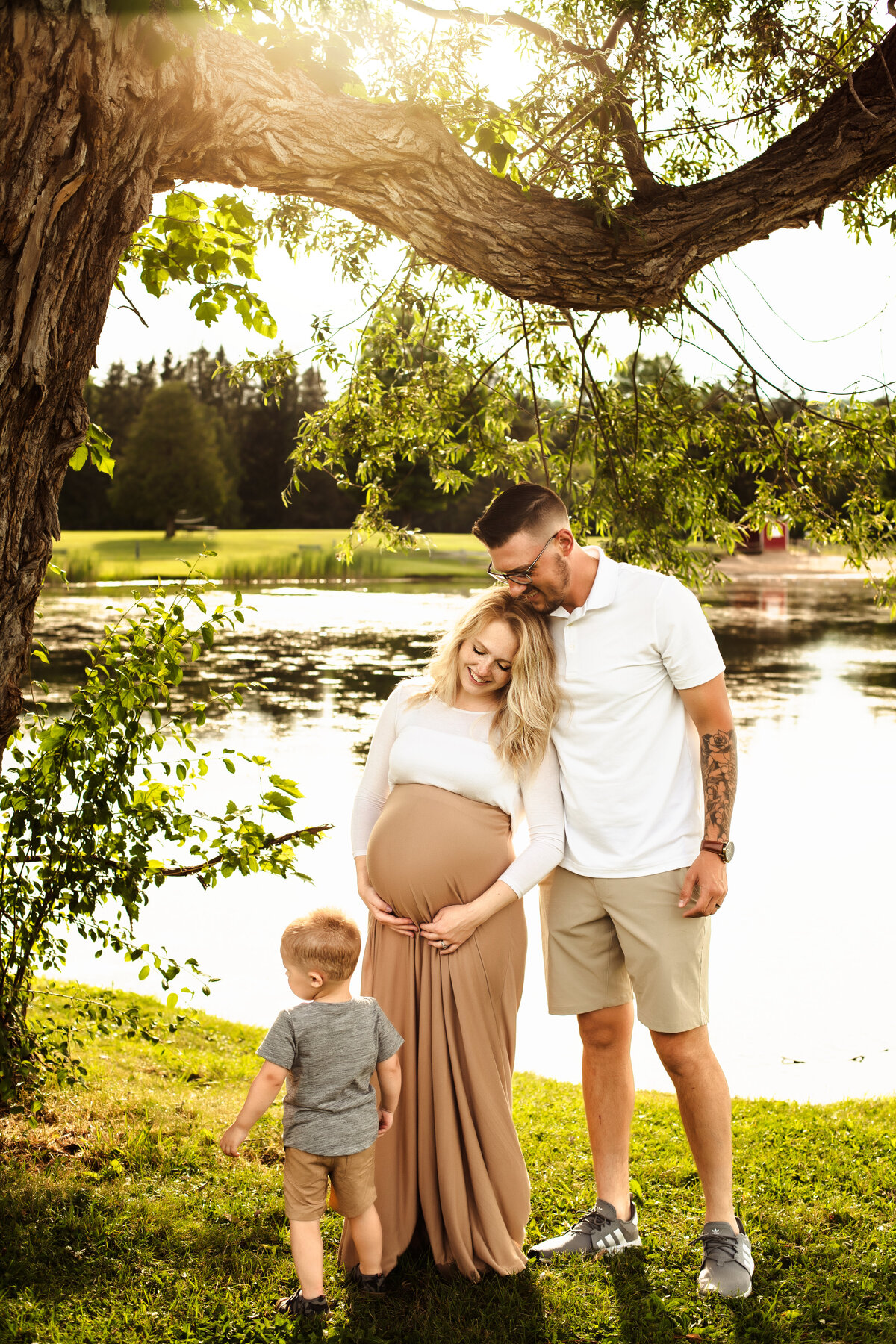Family maternity session at sunset next to lake in Syracuse new york