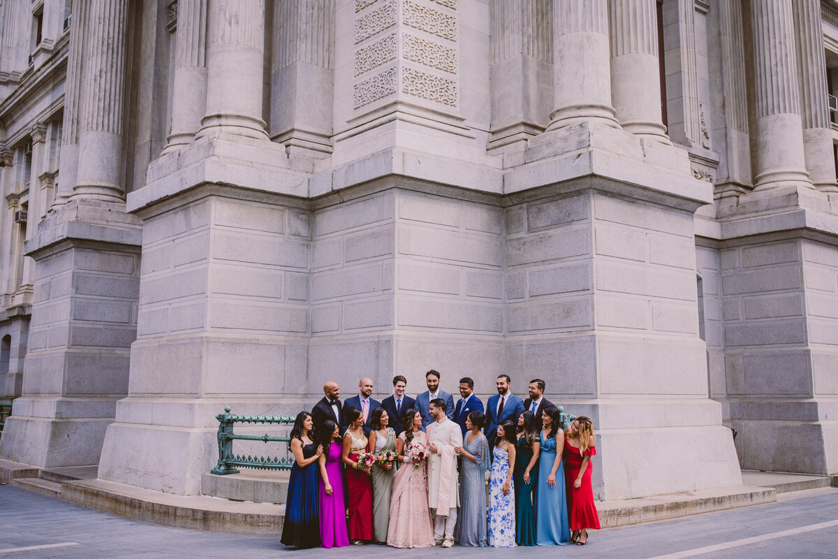 Bridal party look at the indian bride and groom on the wedding day at the philadelphia city hall
