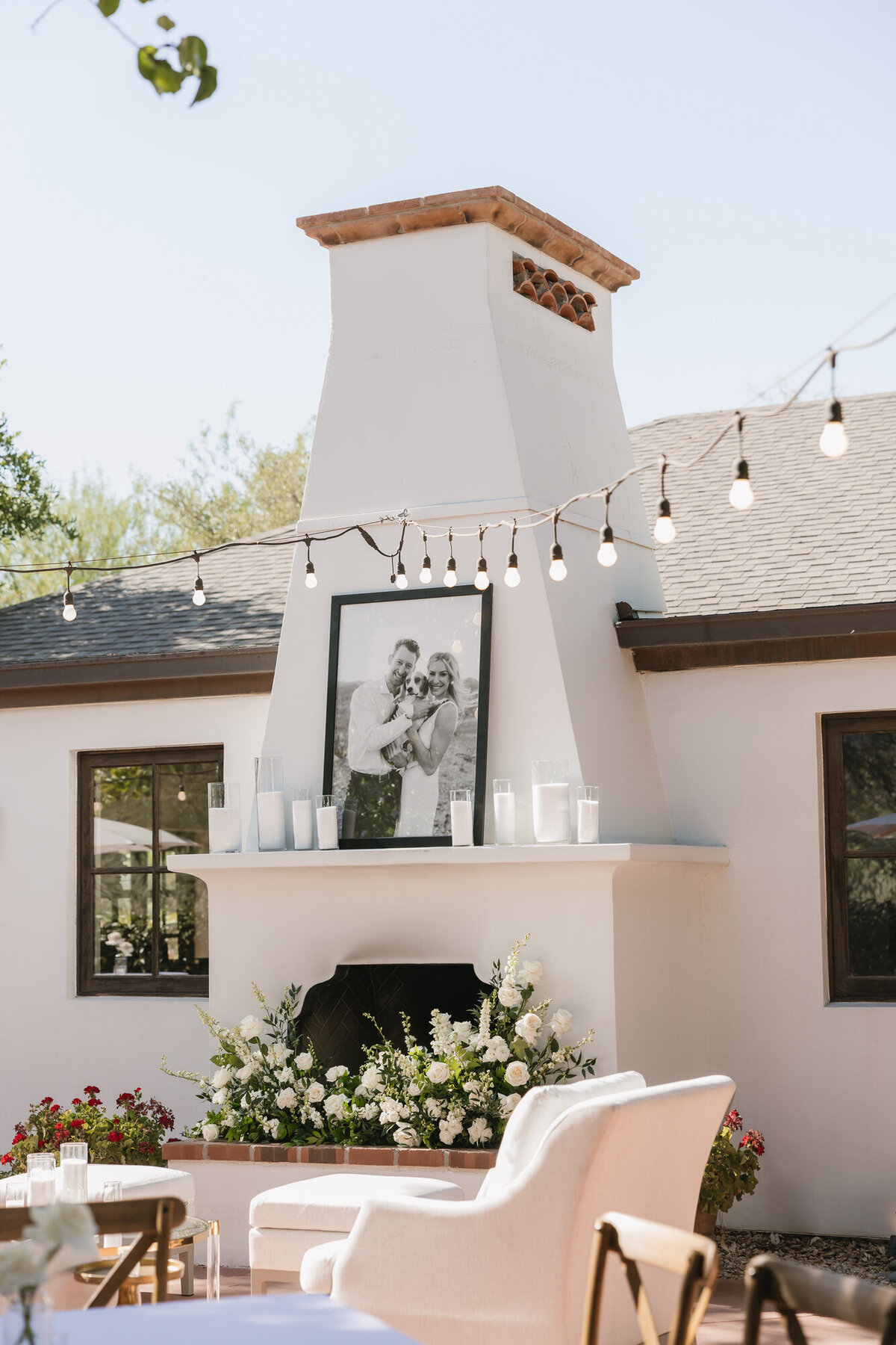 Fireplace with large portrait of bride and groom with dog at El Chorro