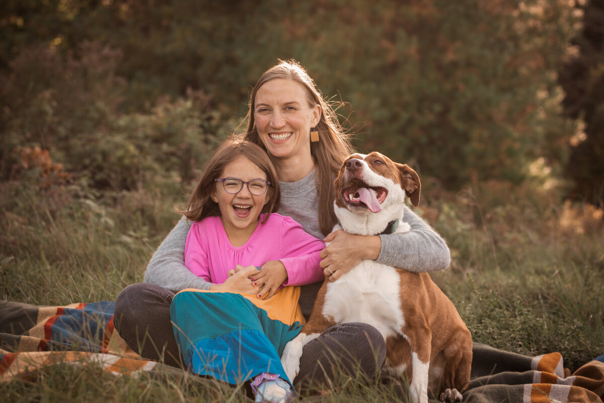 Big hug for daughter and dog from Mom Vermont Dog Photographer