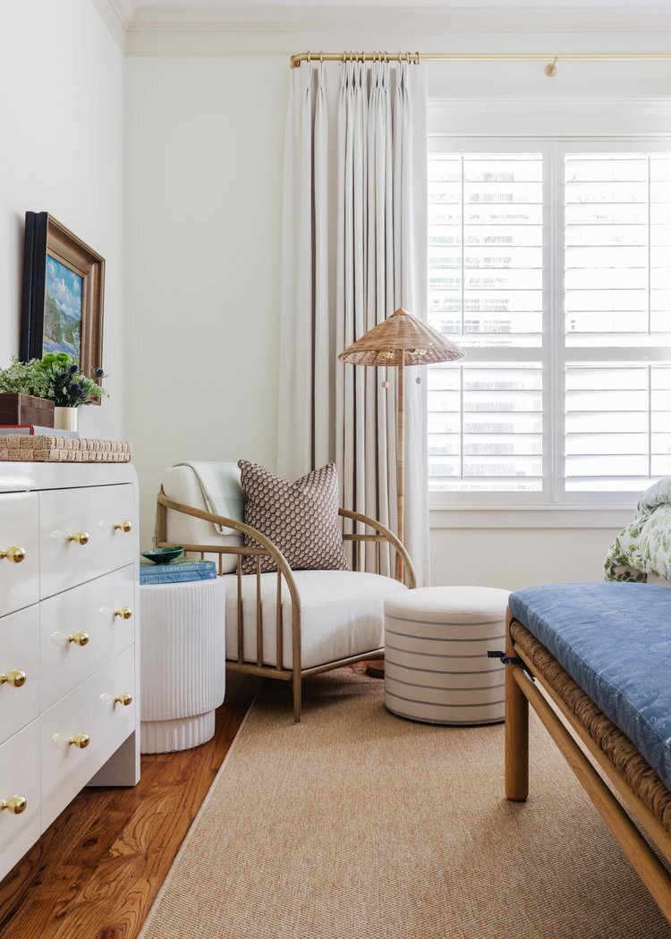 oyster creek studios oak forest remodel white dresser with wooden armchair with white cushion in bedroom