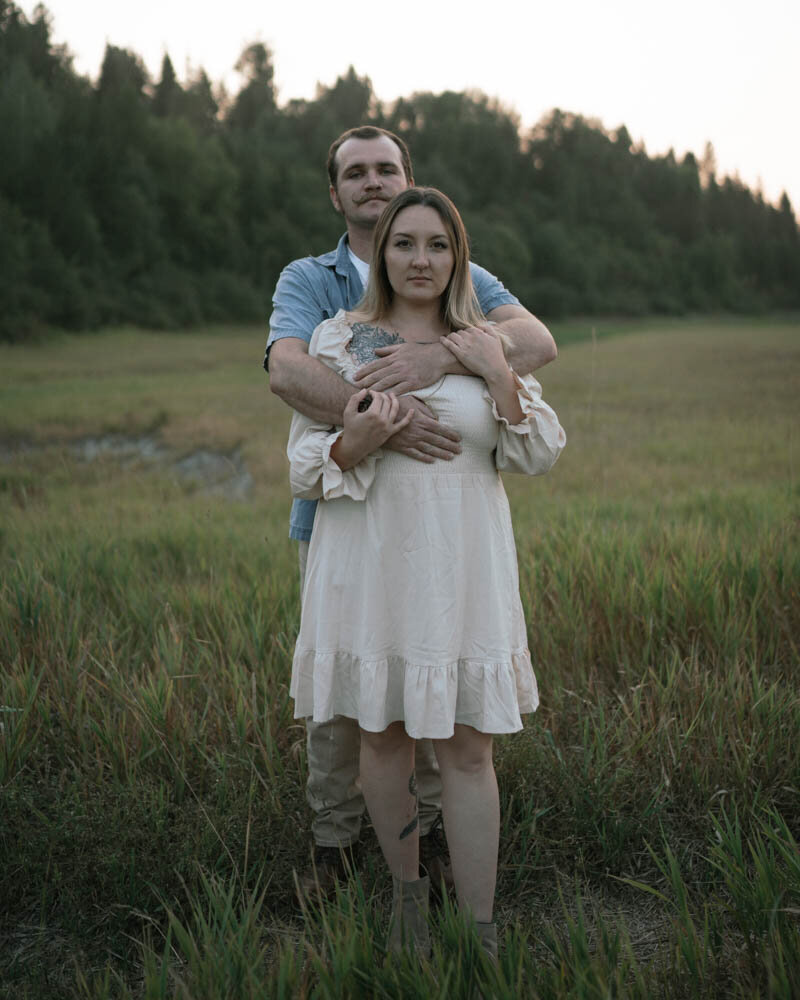An adventurous couple hikes through scenic Washington landscapes, capturing an engagement session filled with exploration and love.
