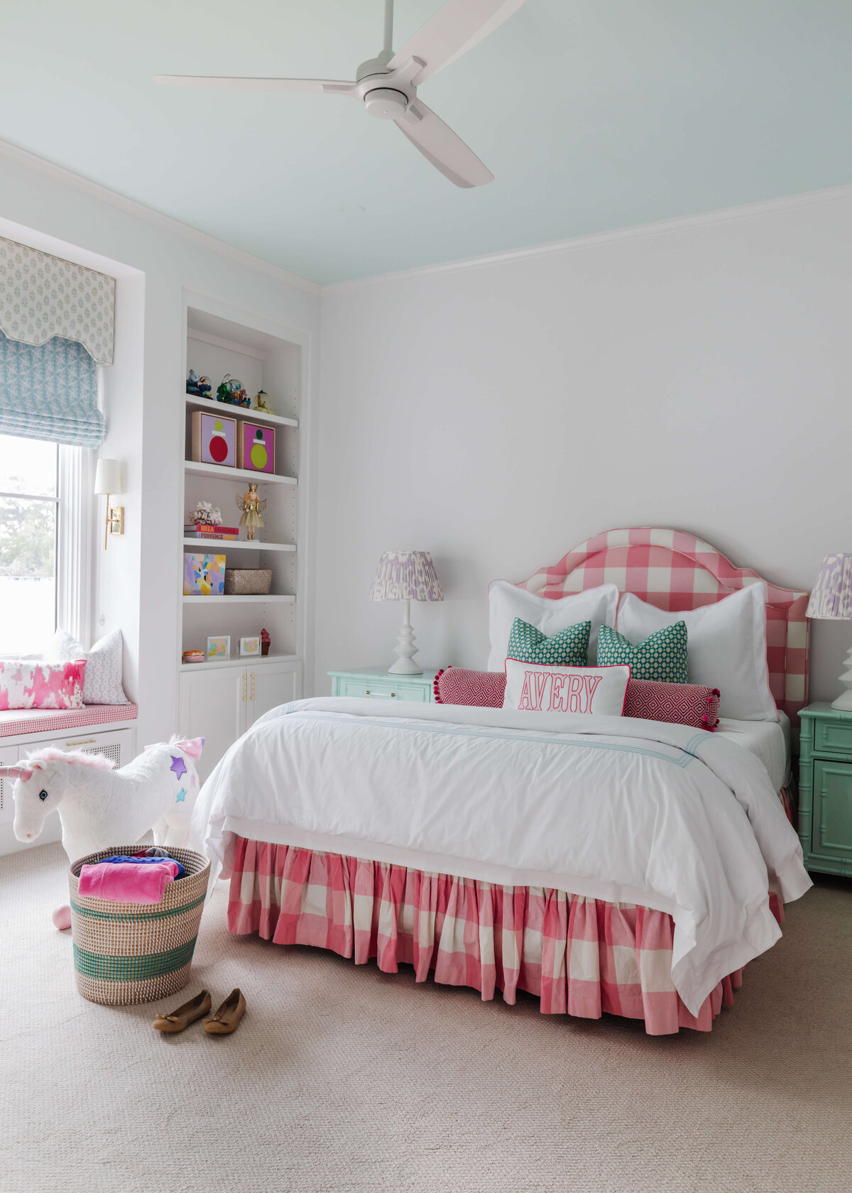oyster creek studios memorial new build pink gigham bed with white bedspread in girls bedroom
