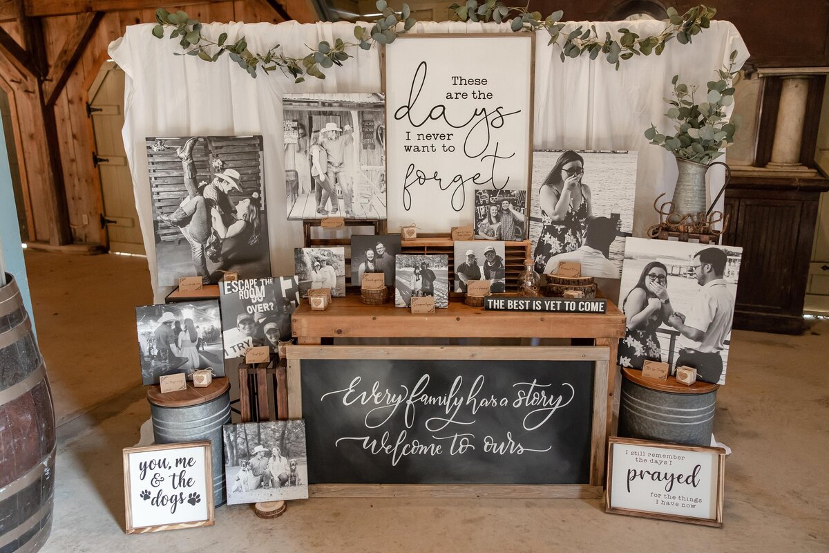 wedding decor black and white images from couple's experiences with quotes on wood by Firefly Photography