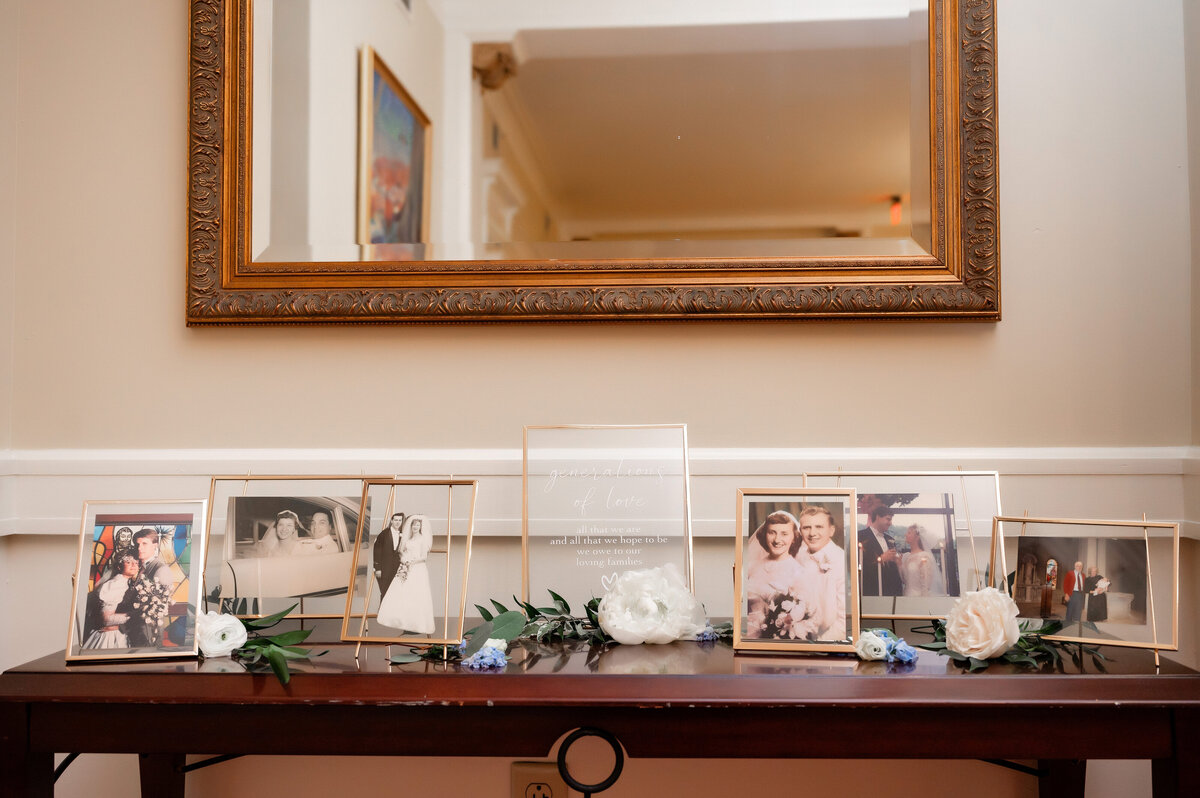 memory table with grandparents photos at wedding