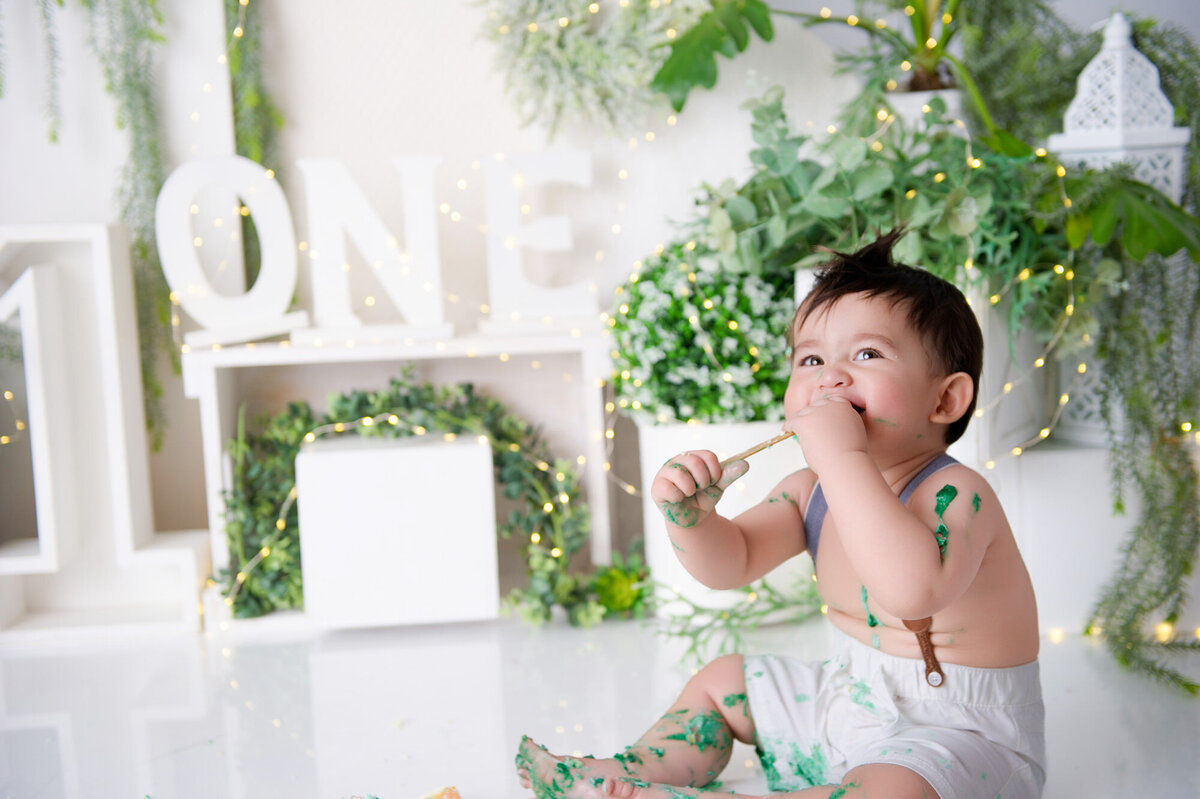 little boy eating cake and icing