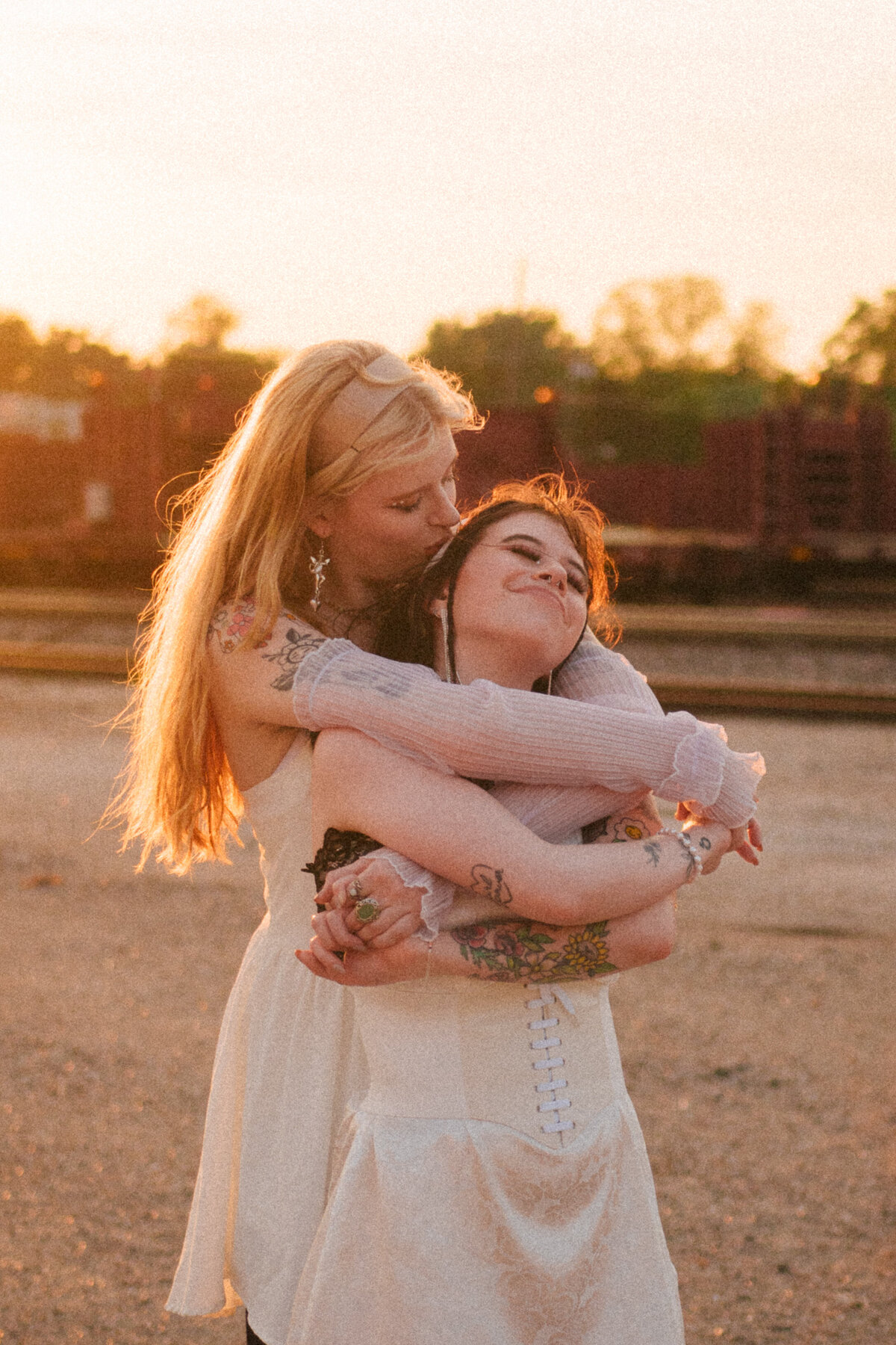 A tattooed couple laughing during their Springfield, MO elopement, captured by Chelsea Stanford.