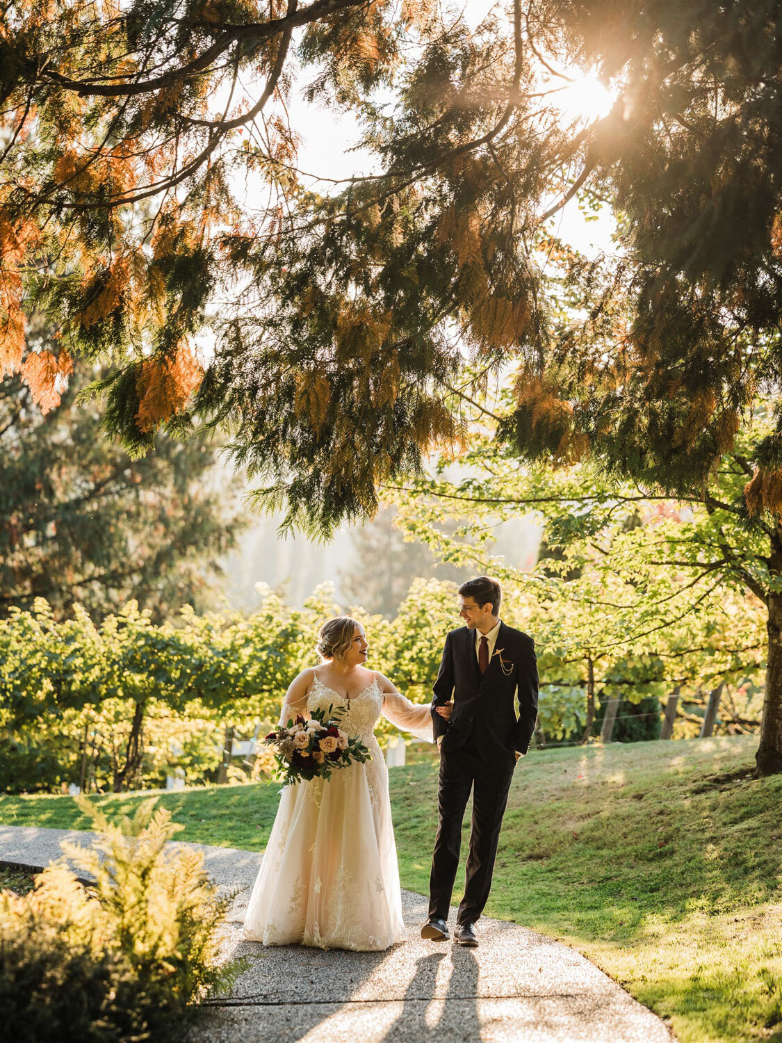 A romantic stroll captured as the couple walks hand-in-hand under the warm glow of golden-hour light