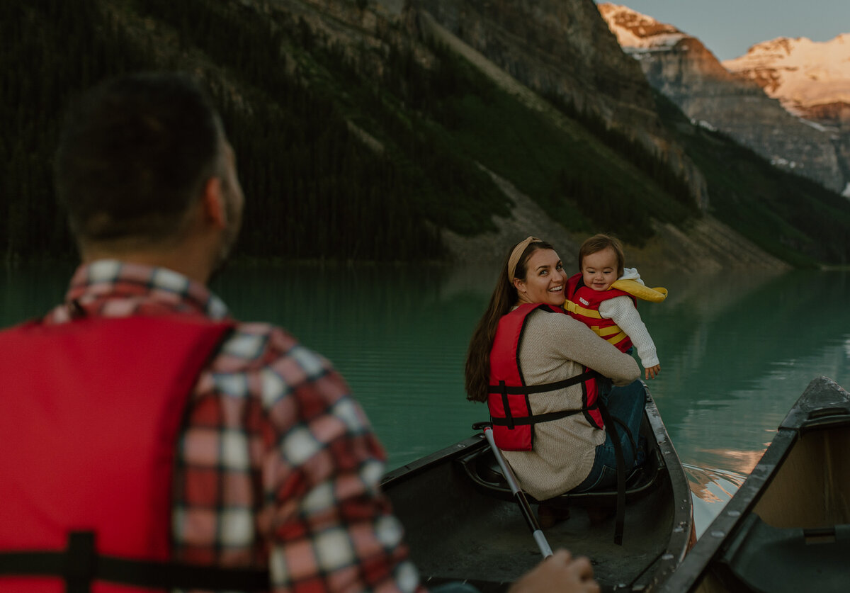 family sunrise canoe trip on lake louise, alberta