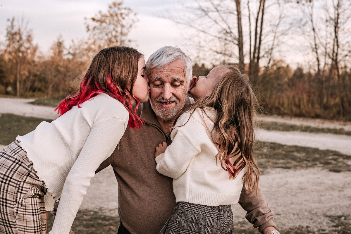 Kids embracing grandpa