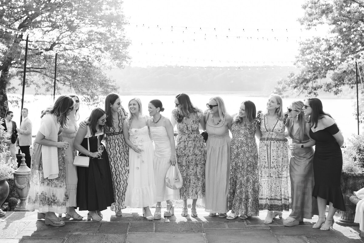 girls laughing during the group photos outside on the terrace of Wainwright House