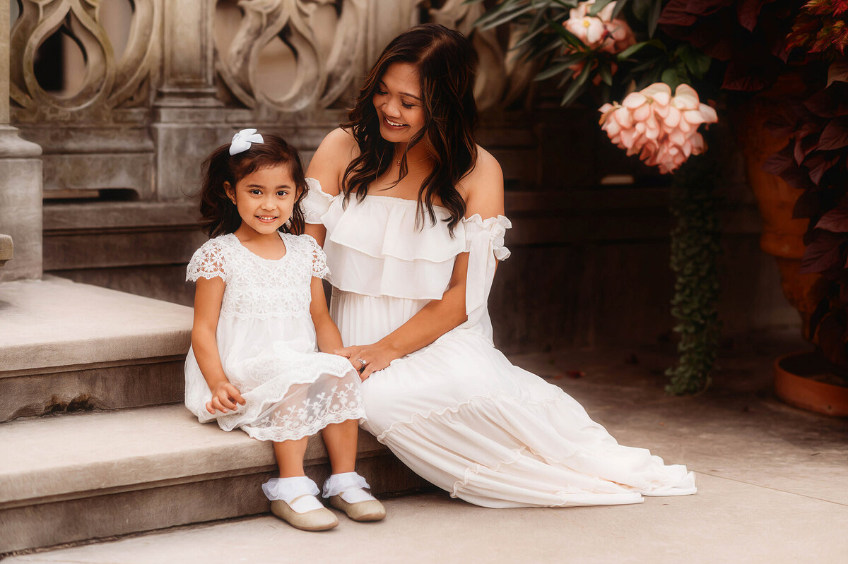 Mother embraces her daughter during Family Portraits at Biltmore Estate in Asheville, NC.