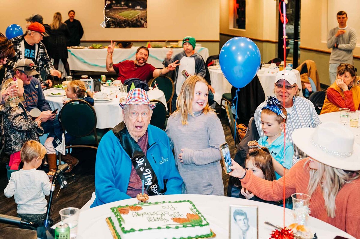 Man surrounded by family at his 90th birthday party in Missoula, MT