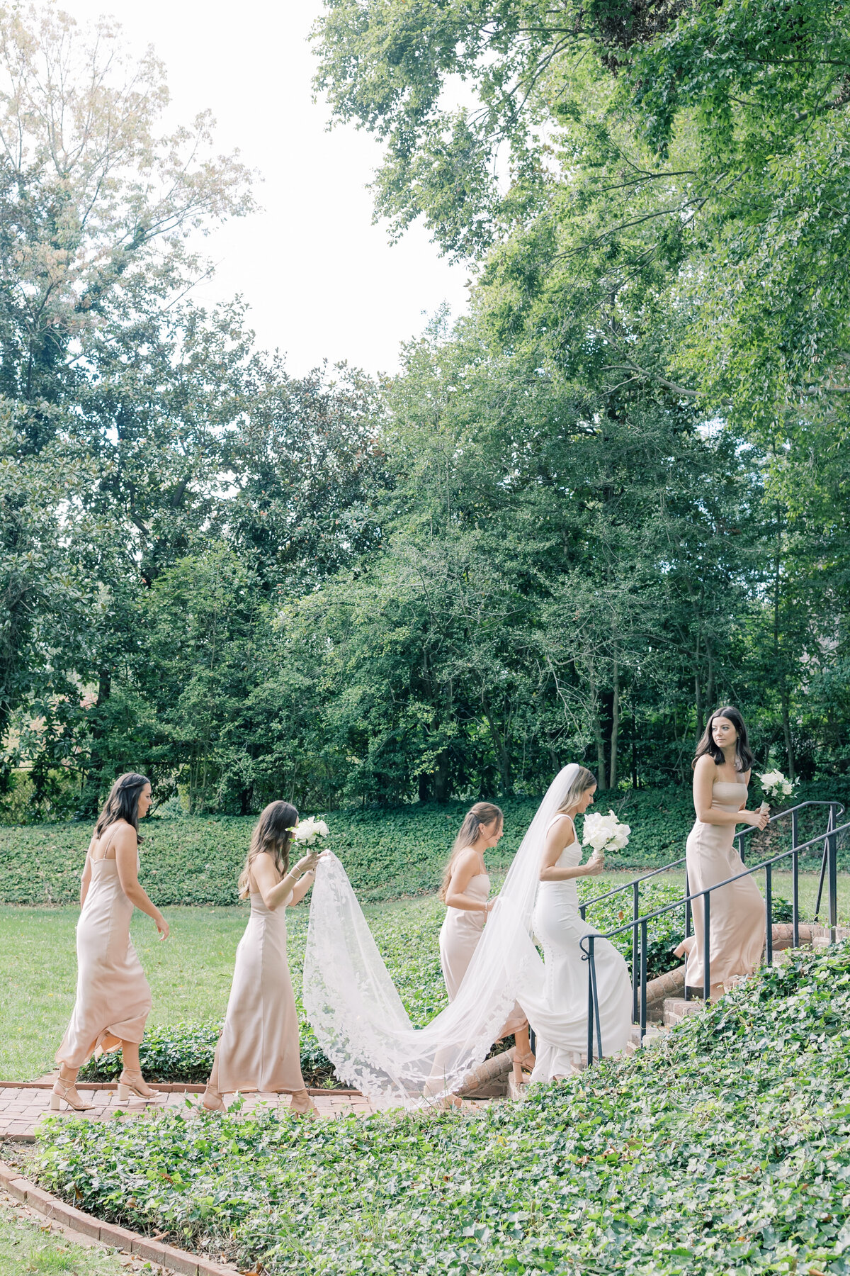 Atlanta Wedding Photographers | Bride With Bridesmaids Walking Up The Stairs