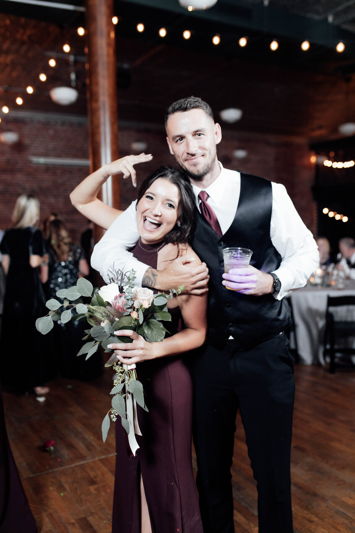Bridal party dancing at reception. 