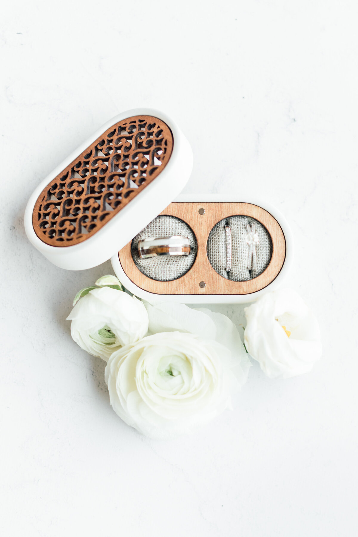 photo of the bride and grooms ring box with both sets of rings
