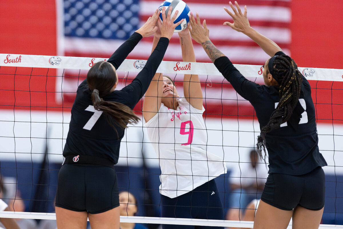 USA's Anna Loberg blocks a shot vs Texas State in a Sunbelt Conference volleyball match.