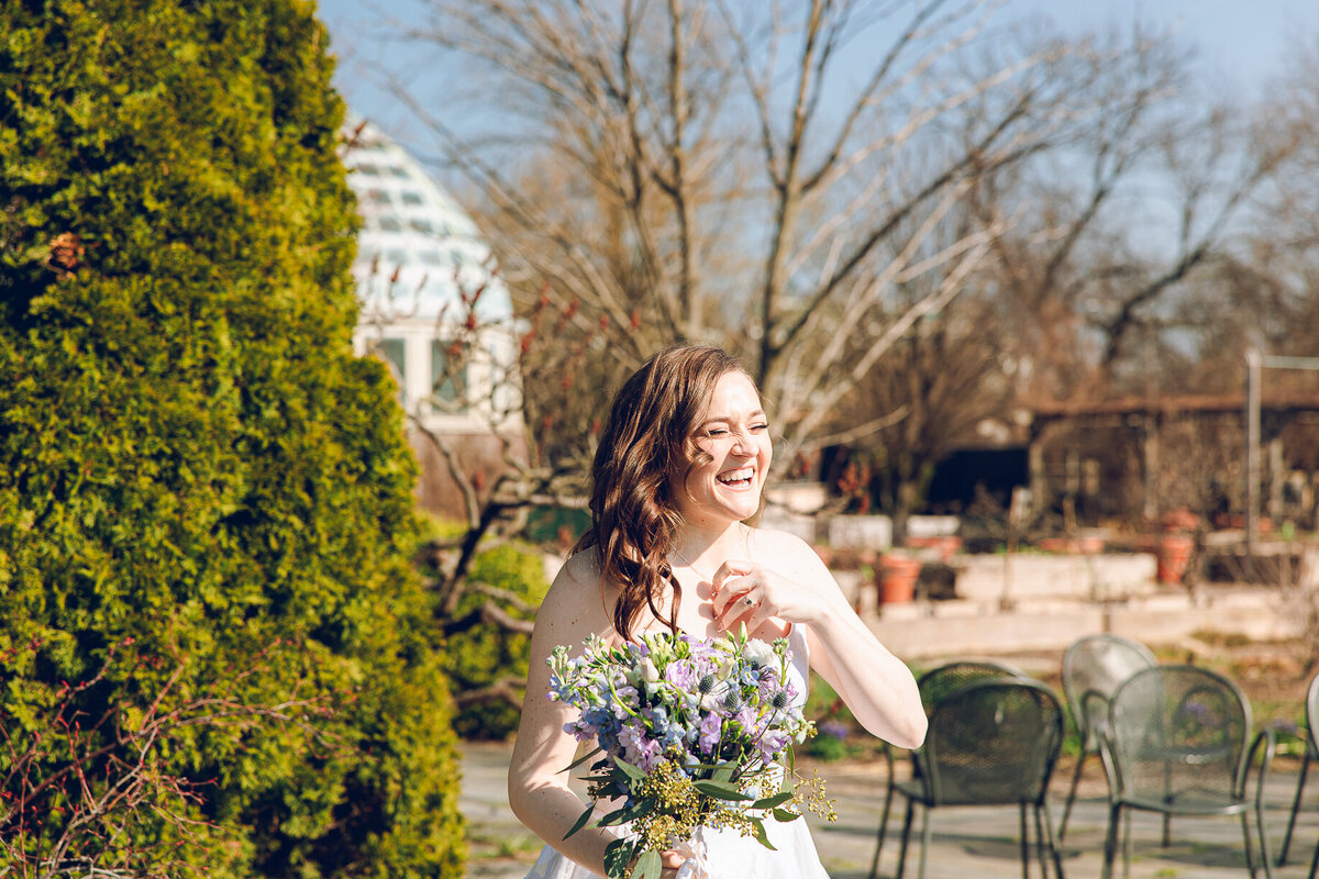 A bride shares a laugh with her parents on her wedding day at the Garfield Park Conservatory in Chicago
