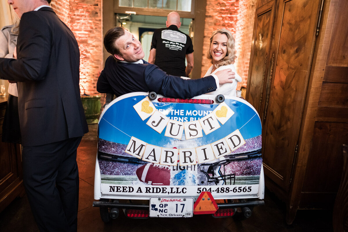 Bride and groom departing Latrobe's wedding in a pedicab