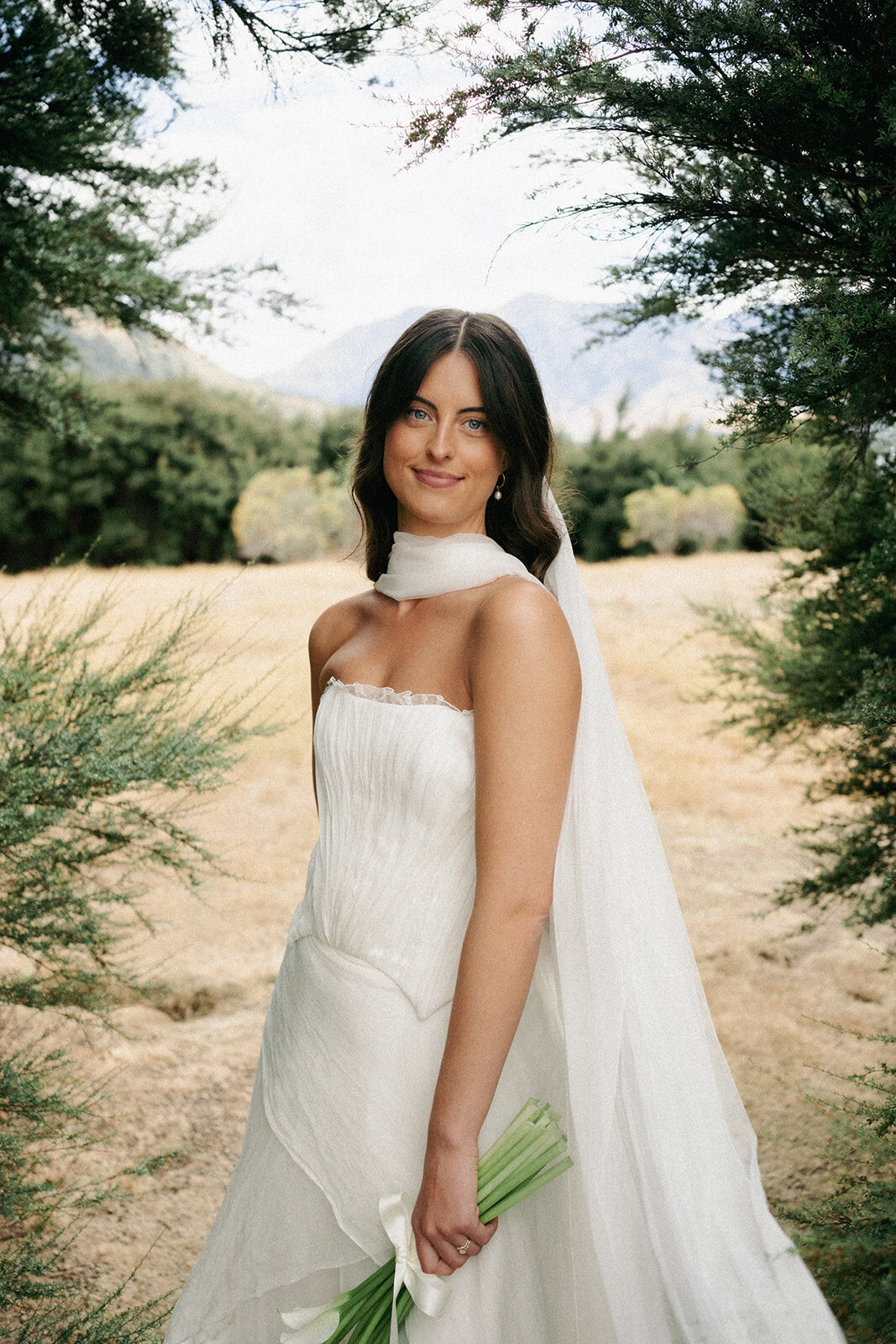 beautifulbrideonherweddingdayinqueenstownwithhairandmakeupnaturalandsoftfrommakeupartistpaigeshipstone13