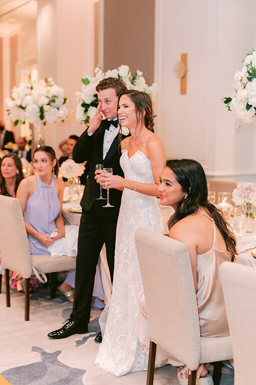 Bride and groom listening to speeches at  at Hotel Crescent Court, Dallas