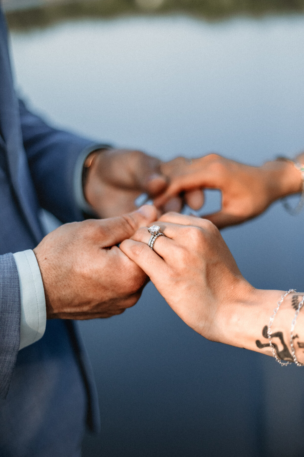 Salem VA wedding and Elopement photographer earthy and moody Charleigh Roberts Photography artsy earthy moody virginia roanoke va east coast lake anna florals bride and groom golden hour artsy ring shot